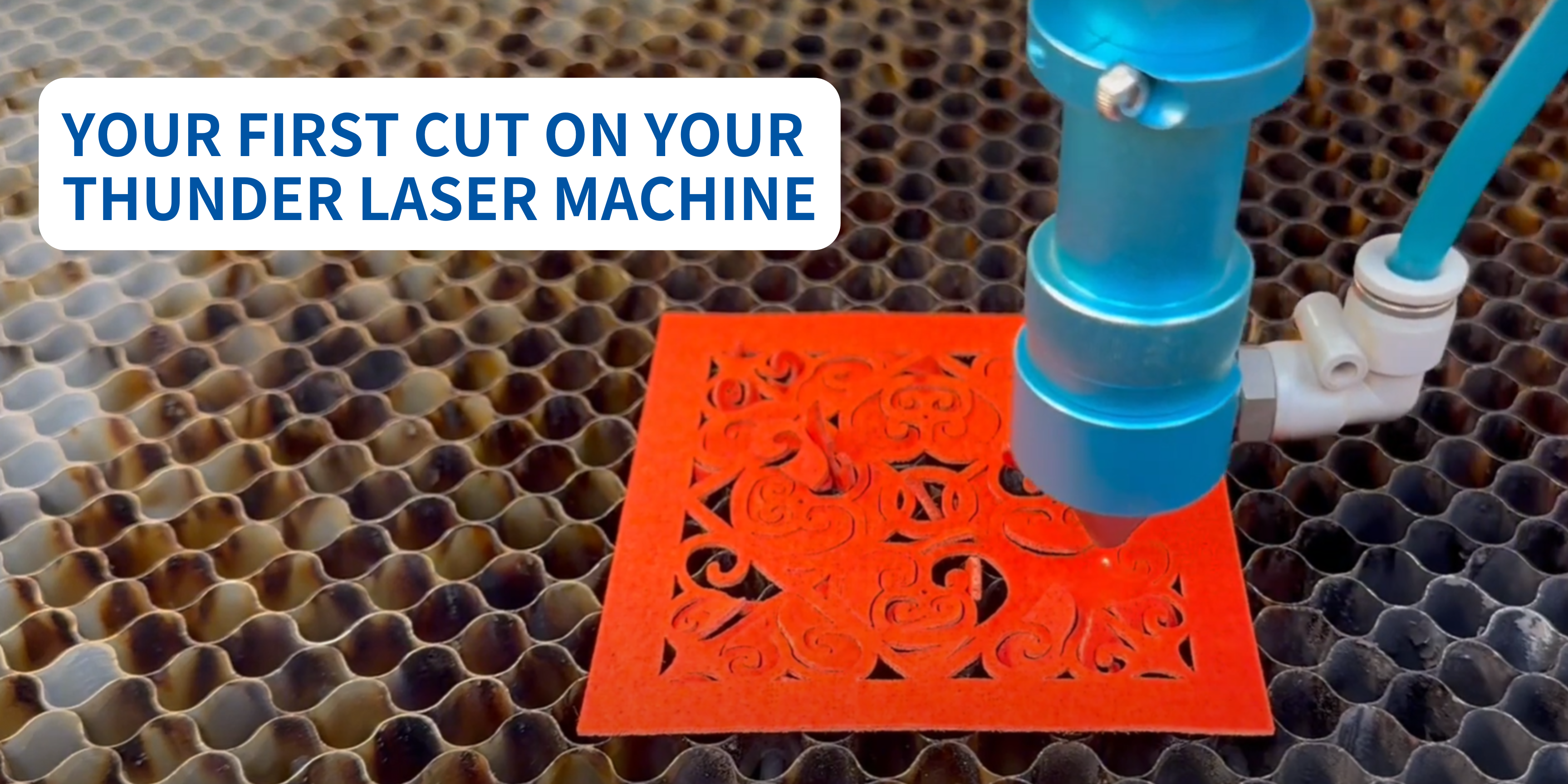 COVER BANNER FOR BLOG: FIRST CUT ON YOUR LASERMACHINE. image of a red sheet of material being cut by a Nova series thunder laser machine. Close up of the project and the laser nozzle