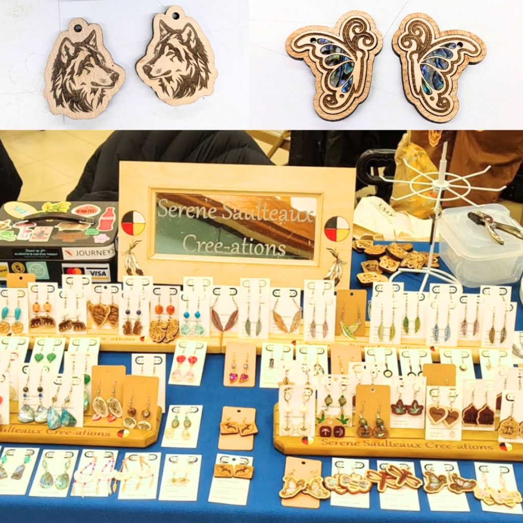 a table at a craft fair with laser cut first nations earrings made of wood, antler, and acrylic